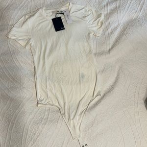 Brand New Aritzia T-shirt body suit. Size XS